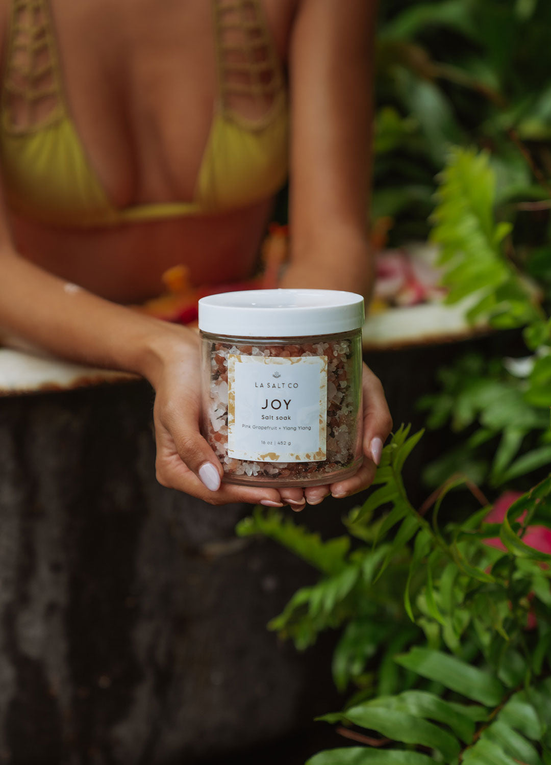 A woman holding Joy Salt Soak